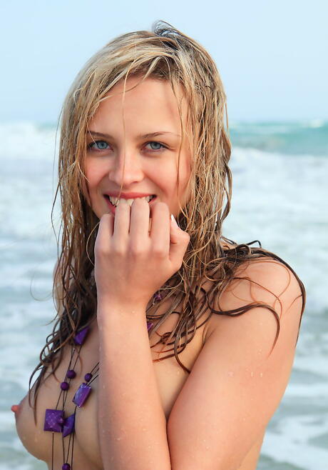 Shapely babe Luciana A revealing tiny tits and hairy beaver on the beach